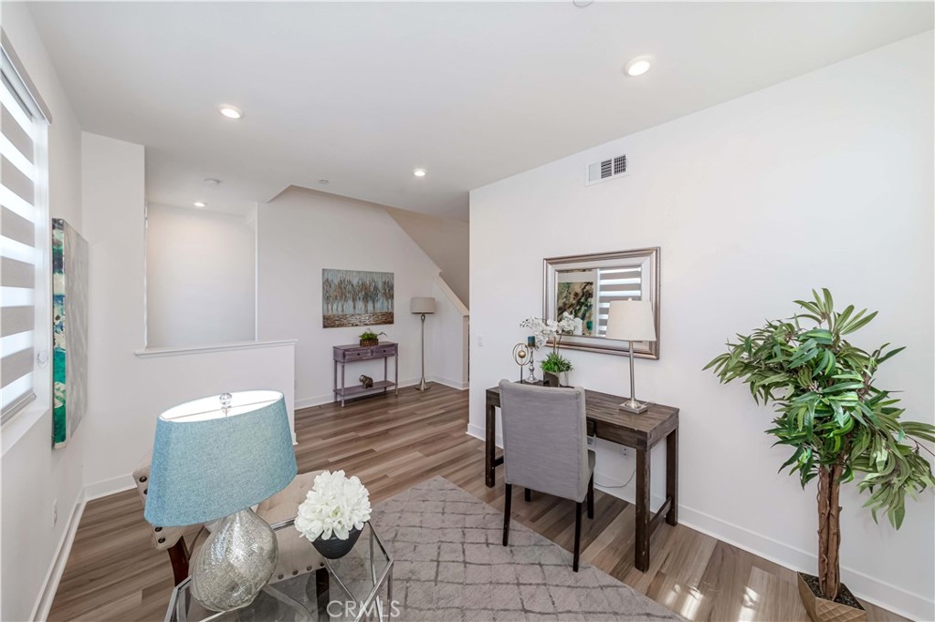 1403 West Bushell Street Anaheim, CA 92805 - Photo 18 of 31 a living room with furniture and a potted plant