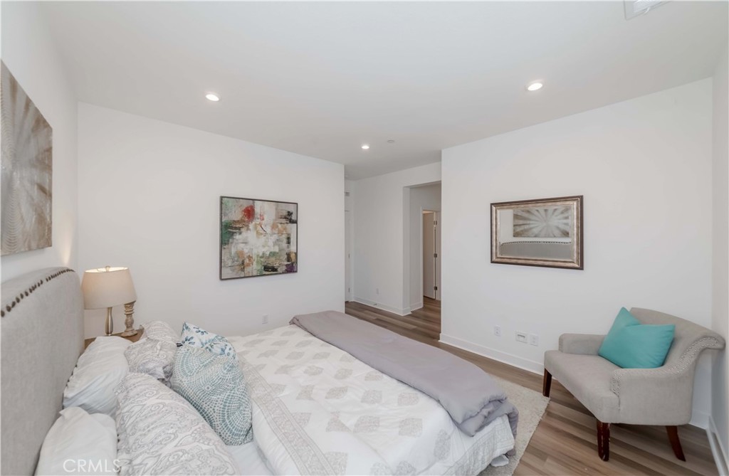 1403 West Bushell Street Anaheim, CA 92805 - Photo 25 of 31 a bedroom with a bed and chair