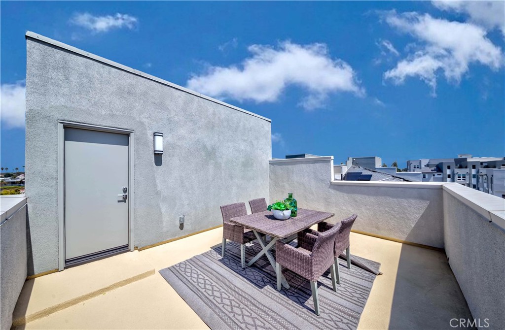 1403 West Bushell Street Anaheim, CA 92805 - Photo 27 of 31 a patio with a table and chairs