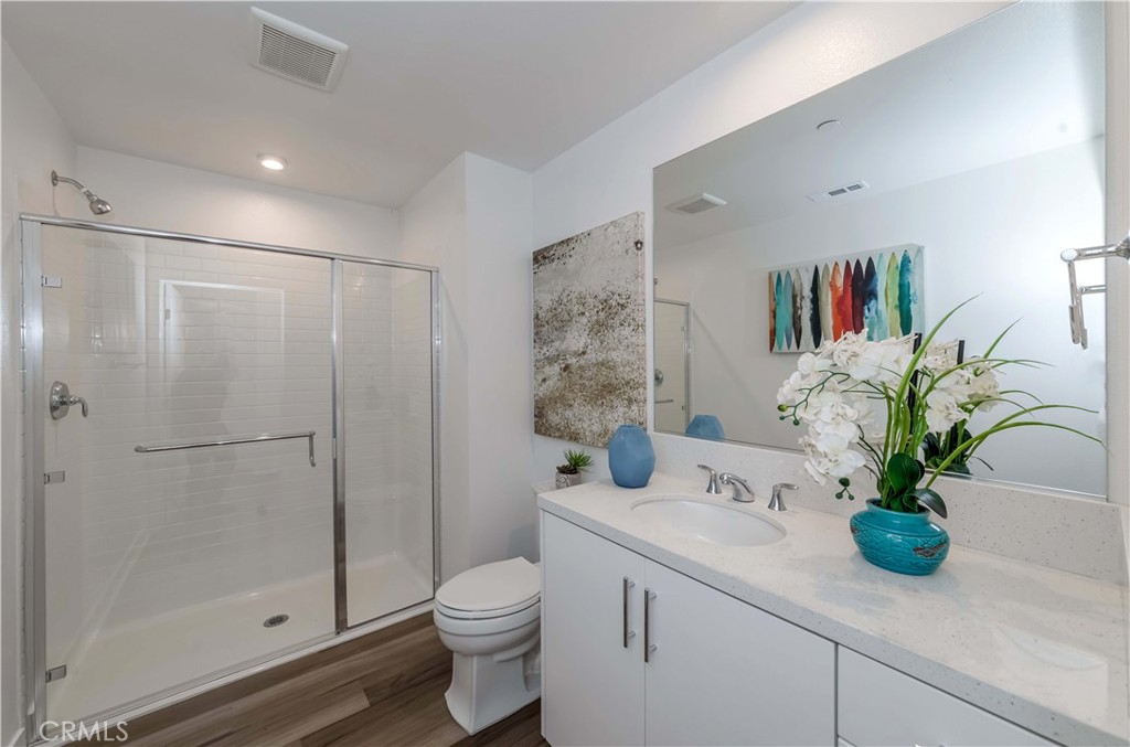 1403 West Bushell Street Anaheim, CA 92805 - Photo 3 of 31 a bathroom with a shower a toilet and a sink