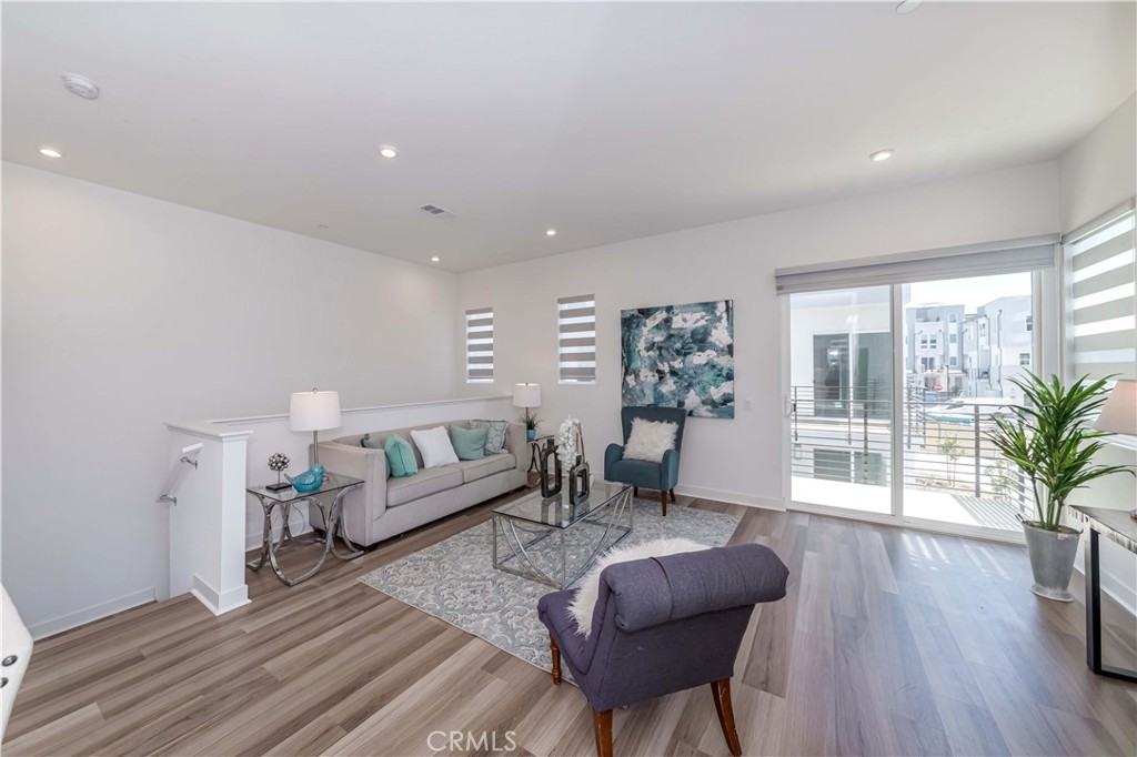 1403 West Bushell Street Anaheim, CA 92805 - Photo 5 of 31 a living room with furniture and a large window