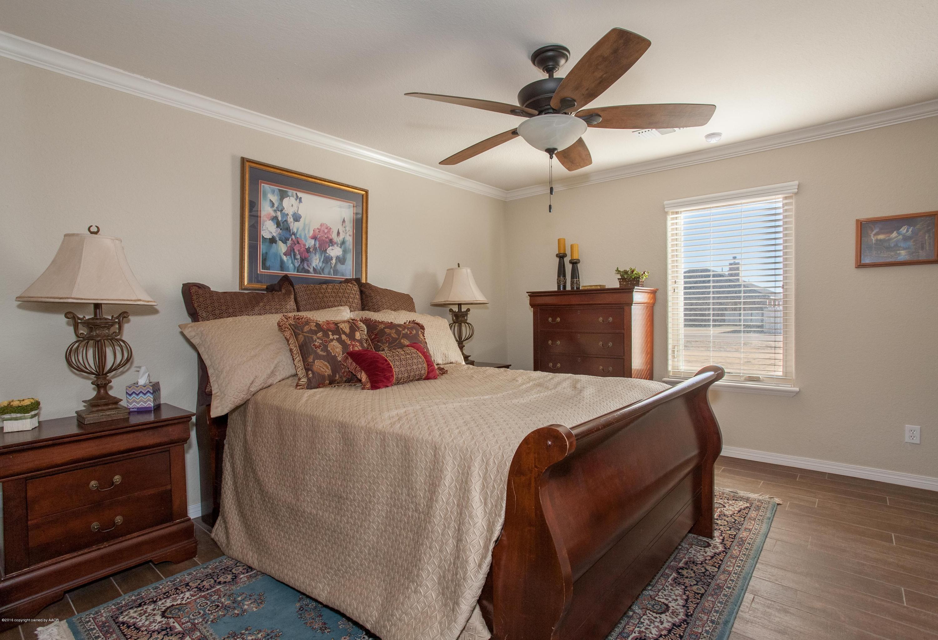 18000 Morning Star Road Bushland, TX 79124 - Photo 12 of 53 a bedroom with bed and wooden floor