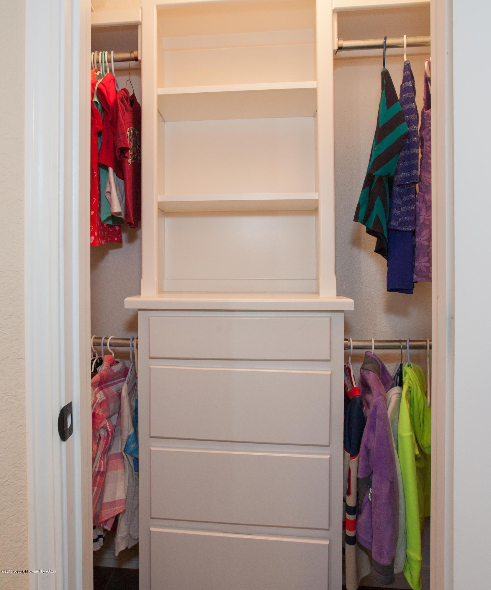 18000 Morning Star Road Bushland, TX 79124 - Photo 23 of 53 a view of walk in closet with clothes and shoes