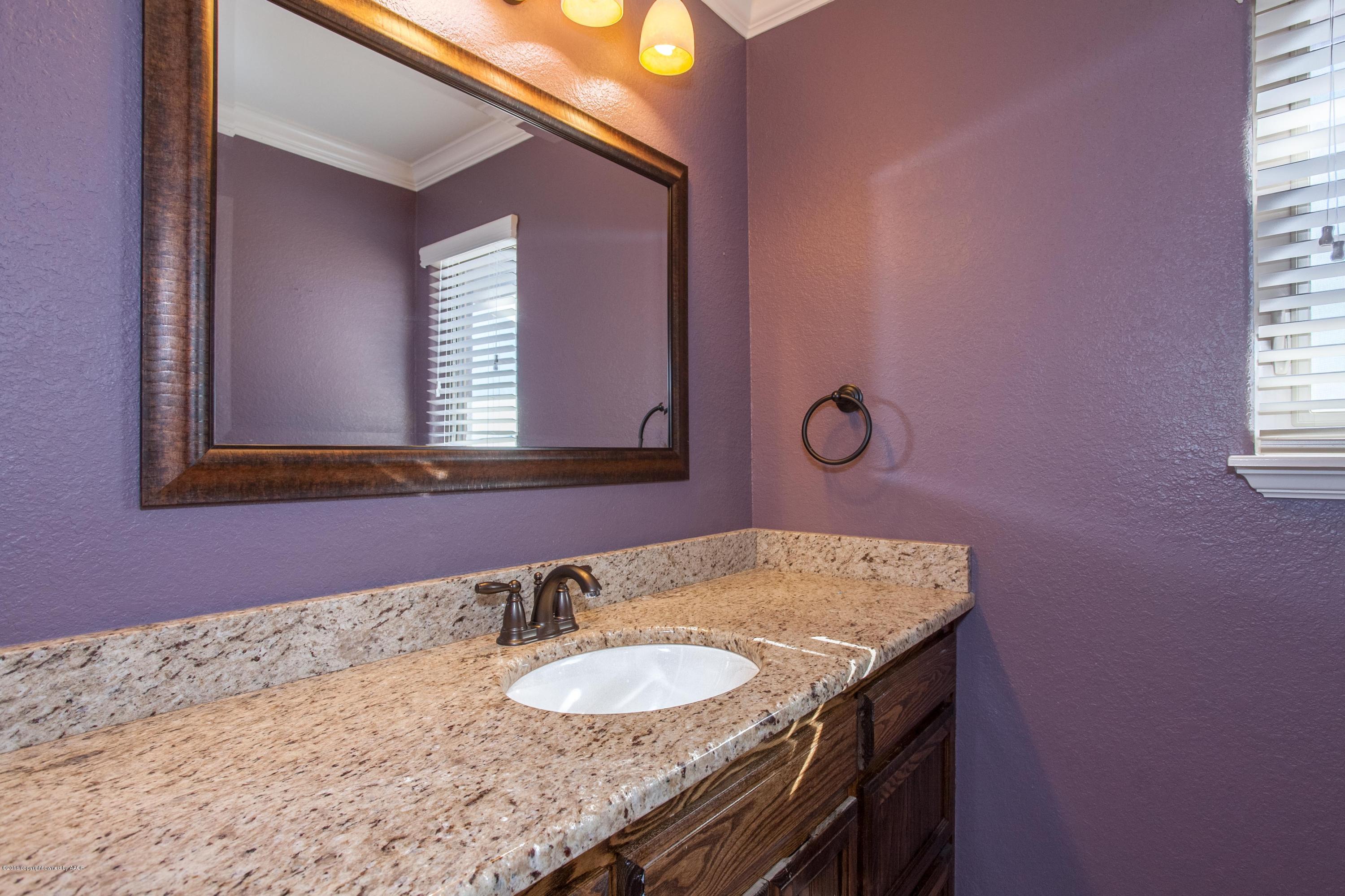 18000 Morning Star Road Bushland, TX 79124 - Photo 24 of 53 a bathroom with a granite countertop sink and a mirror