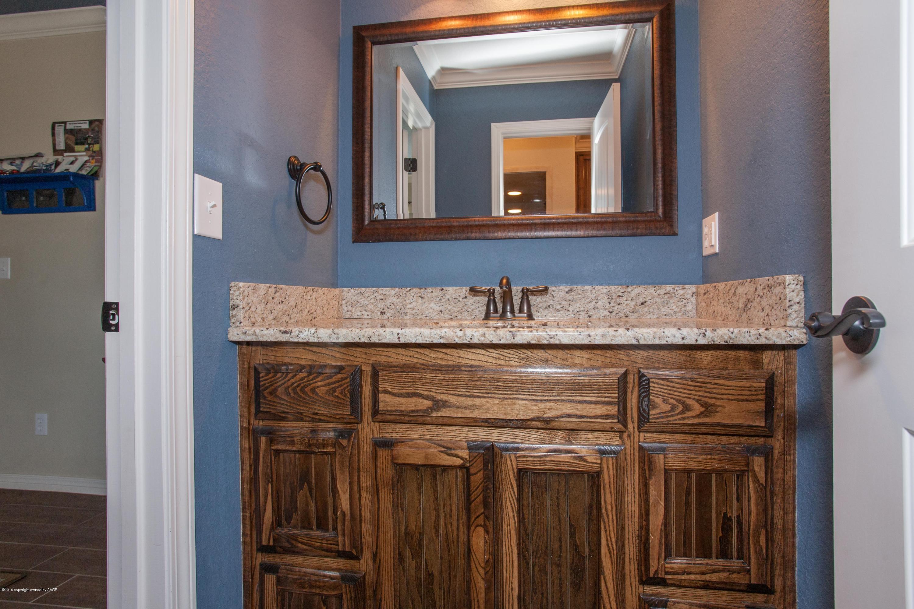 18000 Morning Star Road Bushland, TX 79124 - Photo 27 of 53 a sink with a mirror