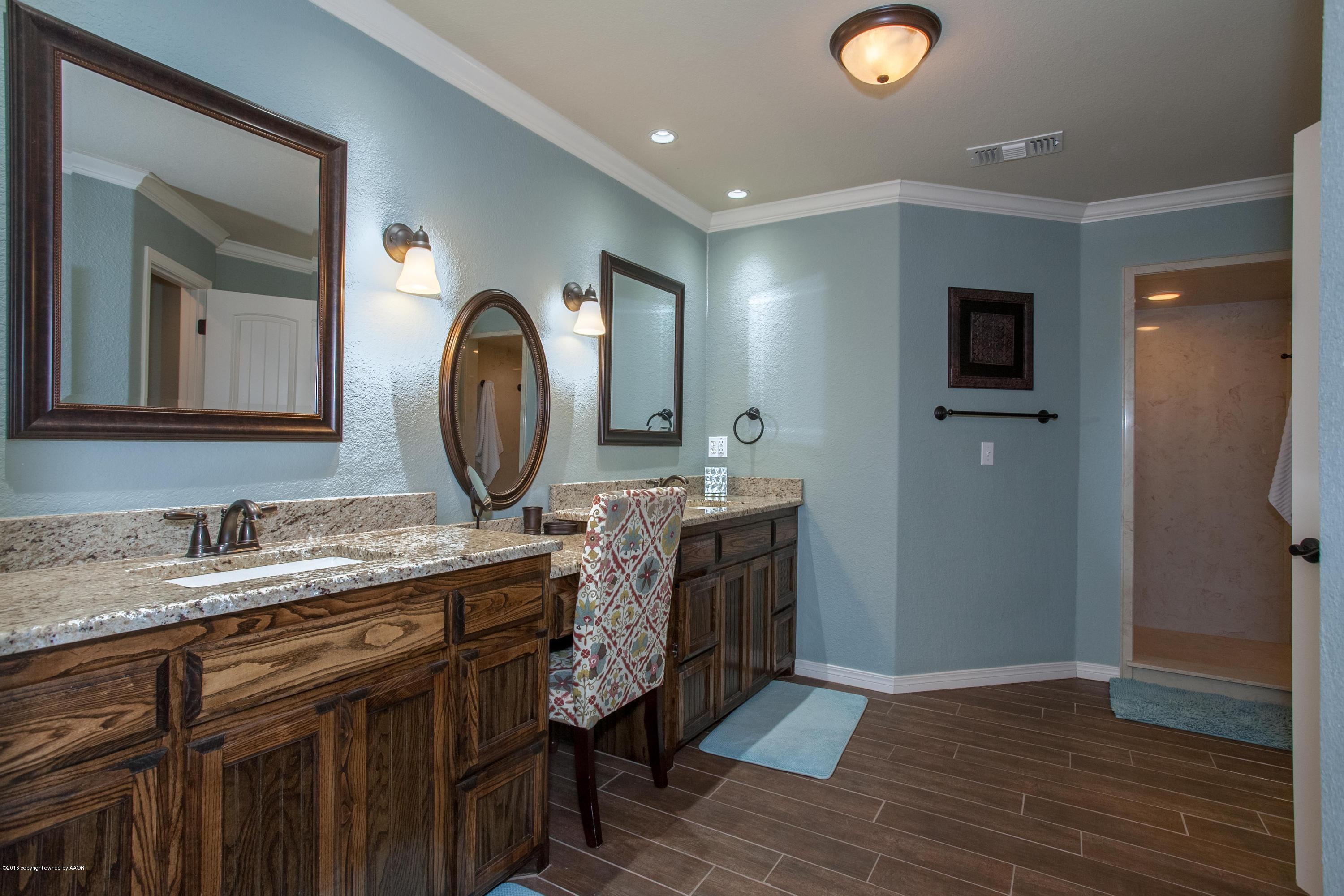 18000 Morning Star Road Bushland, TX 79124 - Photo 33 of 53 a bathroom with a granite countertop double vanity sink and a mirror