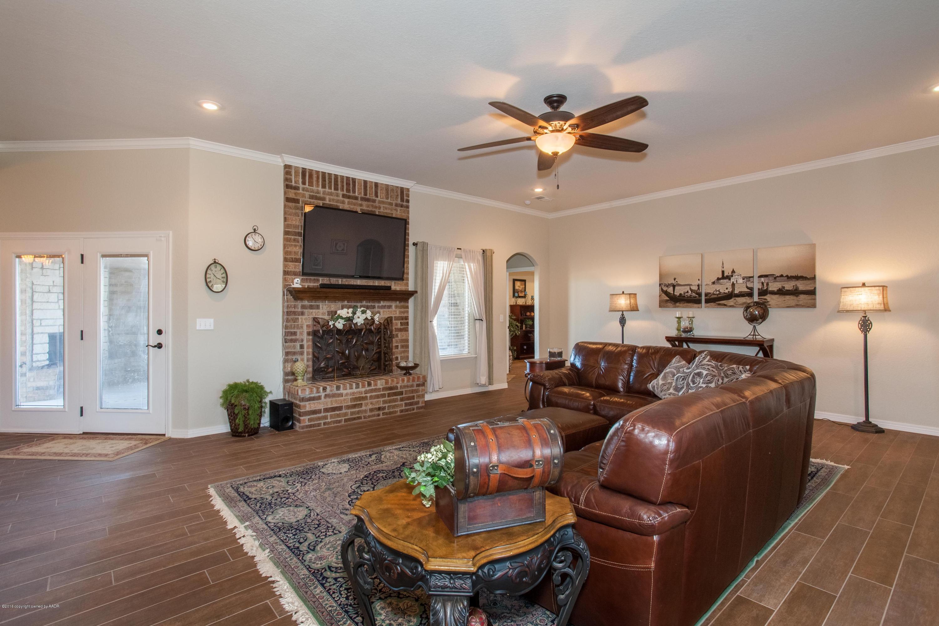 18000 Morning Star Road Bushland, TX 79124 - Photo 6 of 53 a living room with furniture and a fireplace