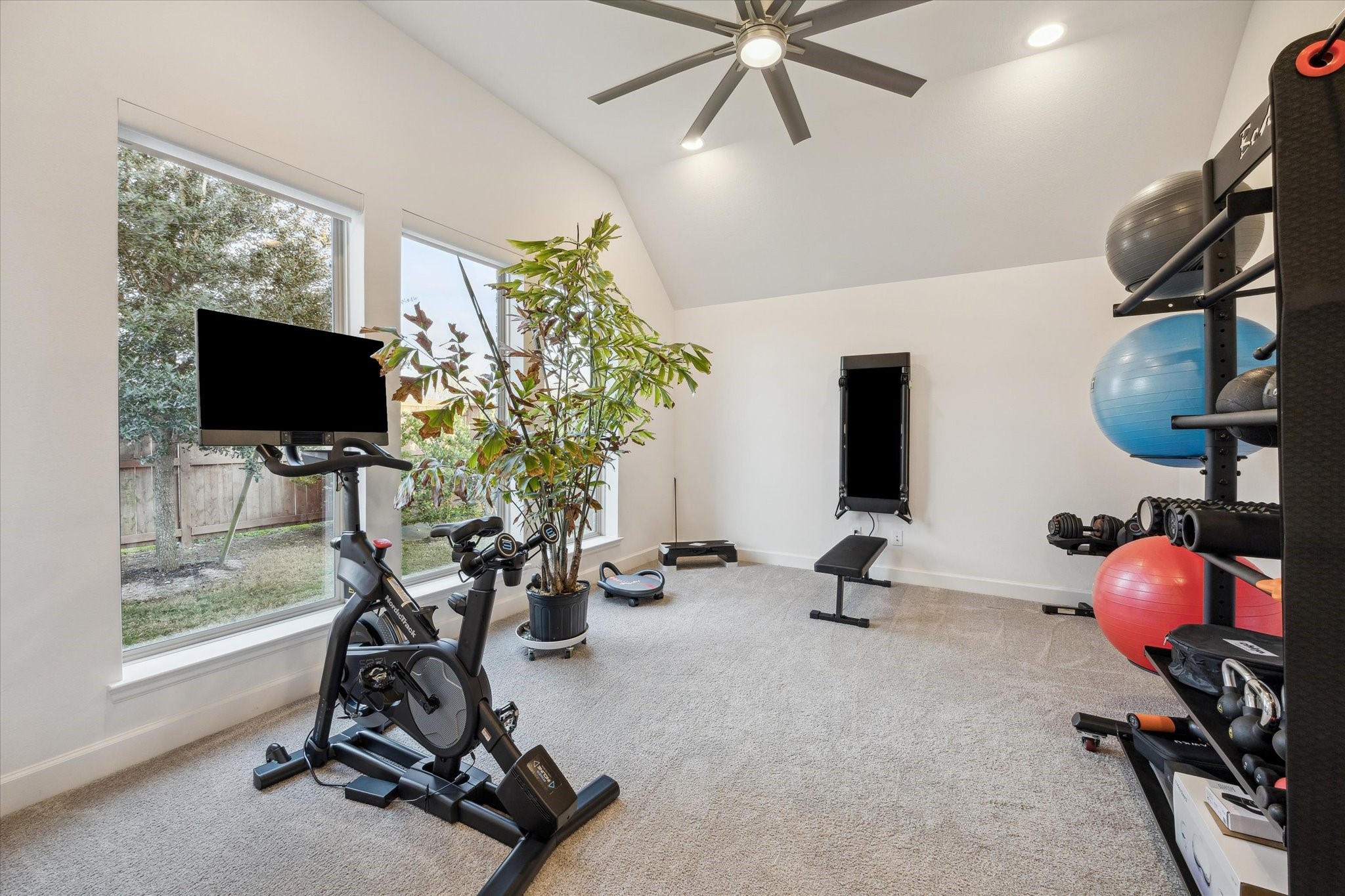 9823 Chapman Trail Manvel, TX 77578 - Photo 24 of 47 On the opposite side of the house, overlooking the backyard, you'll find this spacious flex room. It makes a perfect home gym, gameroom, or media room. It could even serve as a fifth bedroom.