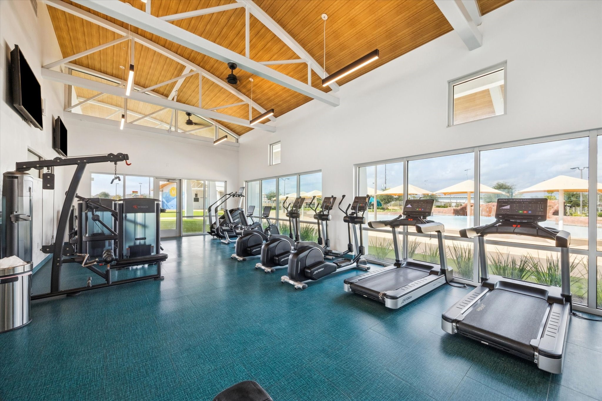 9823 Chapman Trail Manvel, TX 77578 - Photo 33 of 47 Walk over to Oasis Village and you'll find the community gym. There is something for everyone, including cardio machines, spin bikes, treadmills, free weights and strength systems.