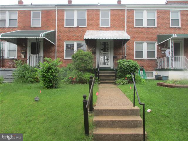 2707 Edison Highway Baltimore, MD 21213 - Photo 1 of 25 a front view of a house with a yard