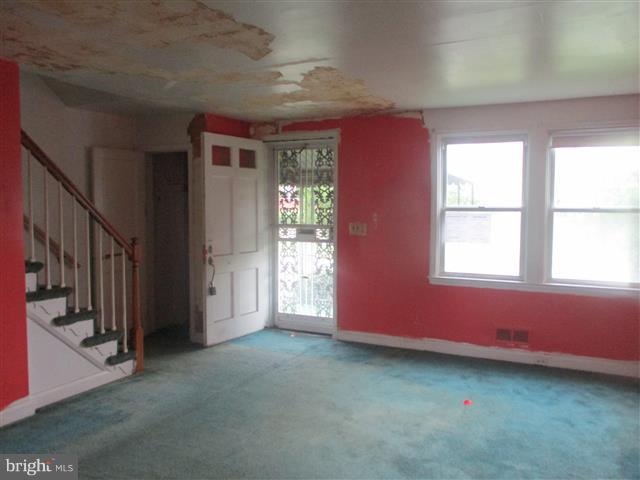 2707 Edison Highway Baltimore, MD 21213 - Photo 2 of 25 an empty room with a window