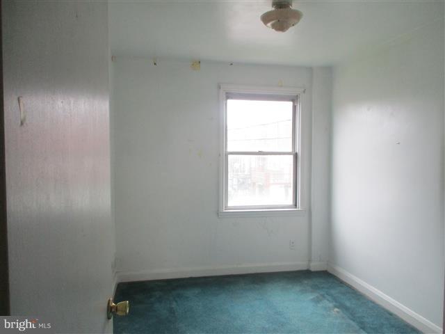 2707 Edison Highway Baltimore, MD 21213 - Photo 11 of 25 an empty room with a window