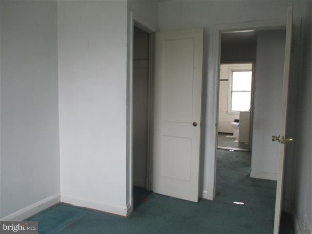 2707 Edison Highway Baltimore, MD 21213 - Photo 12 of 25 a view of an empty room with closet and a bathroom