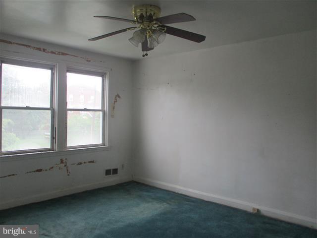 2707 Edison Highway Baltimore, MD 21213 - Photo 16 of 25 an empty room with a window
