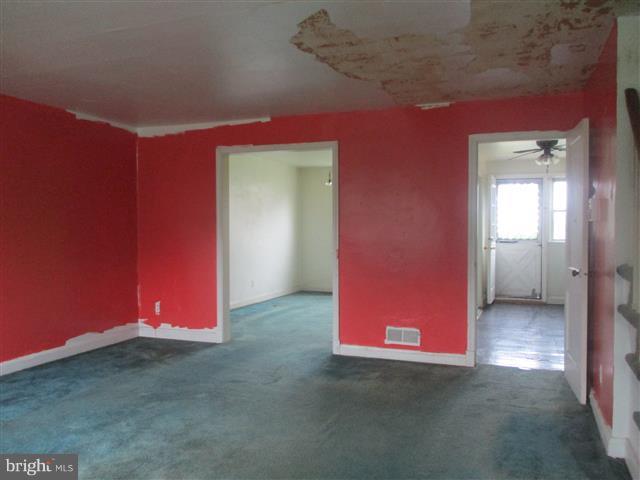 2707 Edison Highway Baltimore, MD 21213 - Photo 3 of 25 a view of a room with red walls