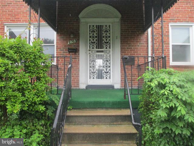2707 Edison Highway Baltimore, MD 21213 - Photo 25 of 25 a front view of a house with a yard