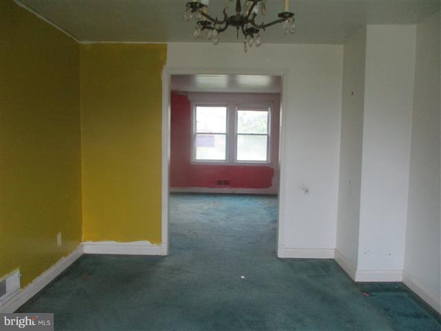 2707 Edison Highway Baltimore, MD 21213 - Photo 5 of 25 an empty room with a window