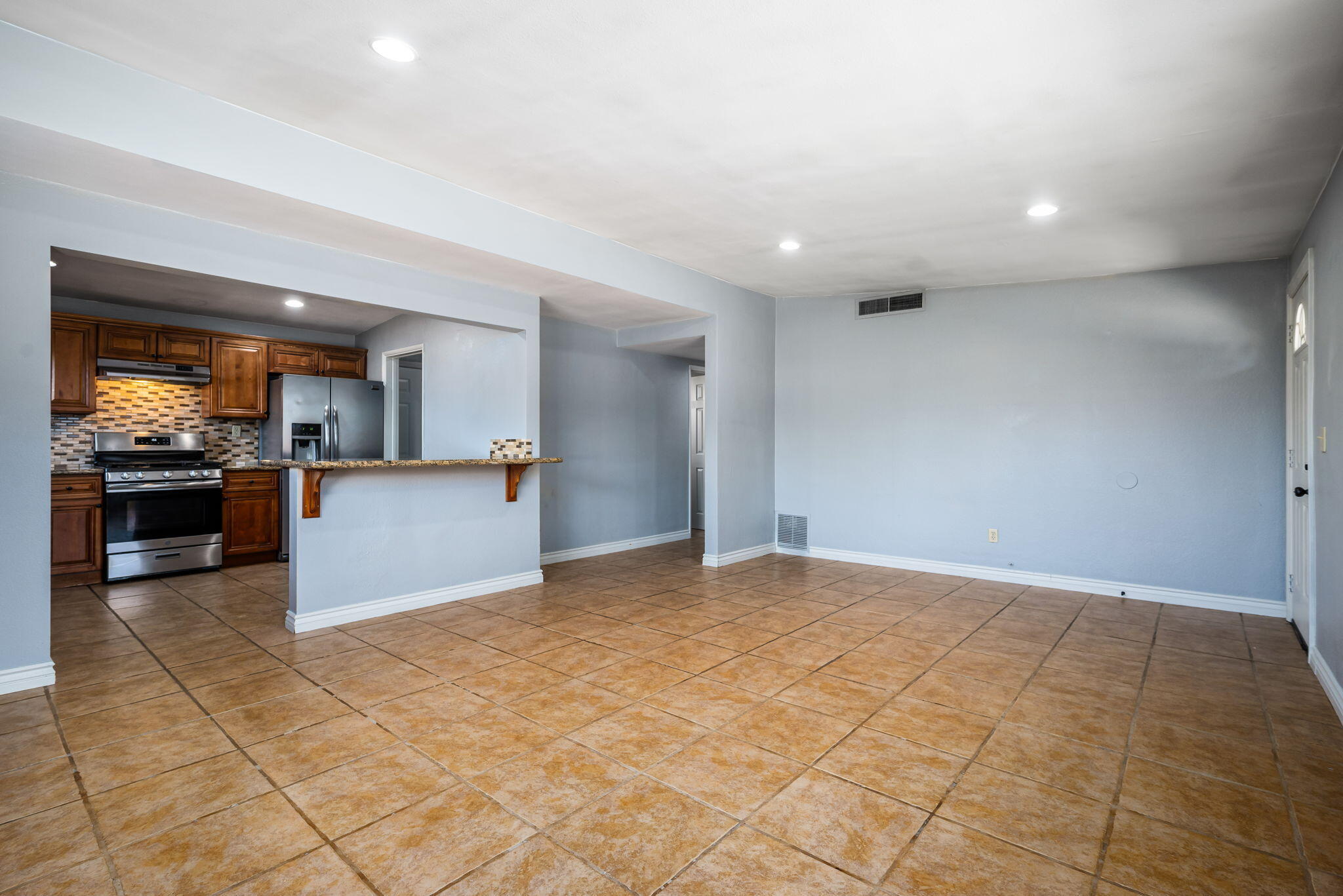 73333 Santa Rosa Way Palm Desert, CA 92260 - Photo 20 of 37 a view of kitchen with granite countertop cabinets and refrigerator