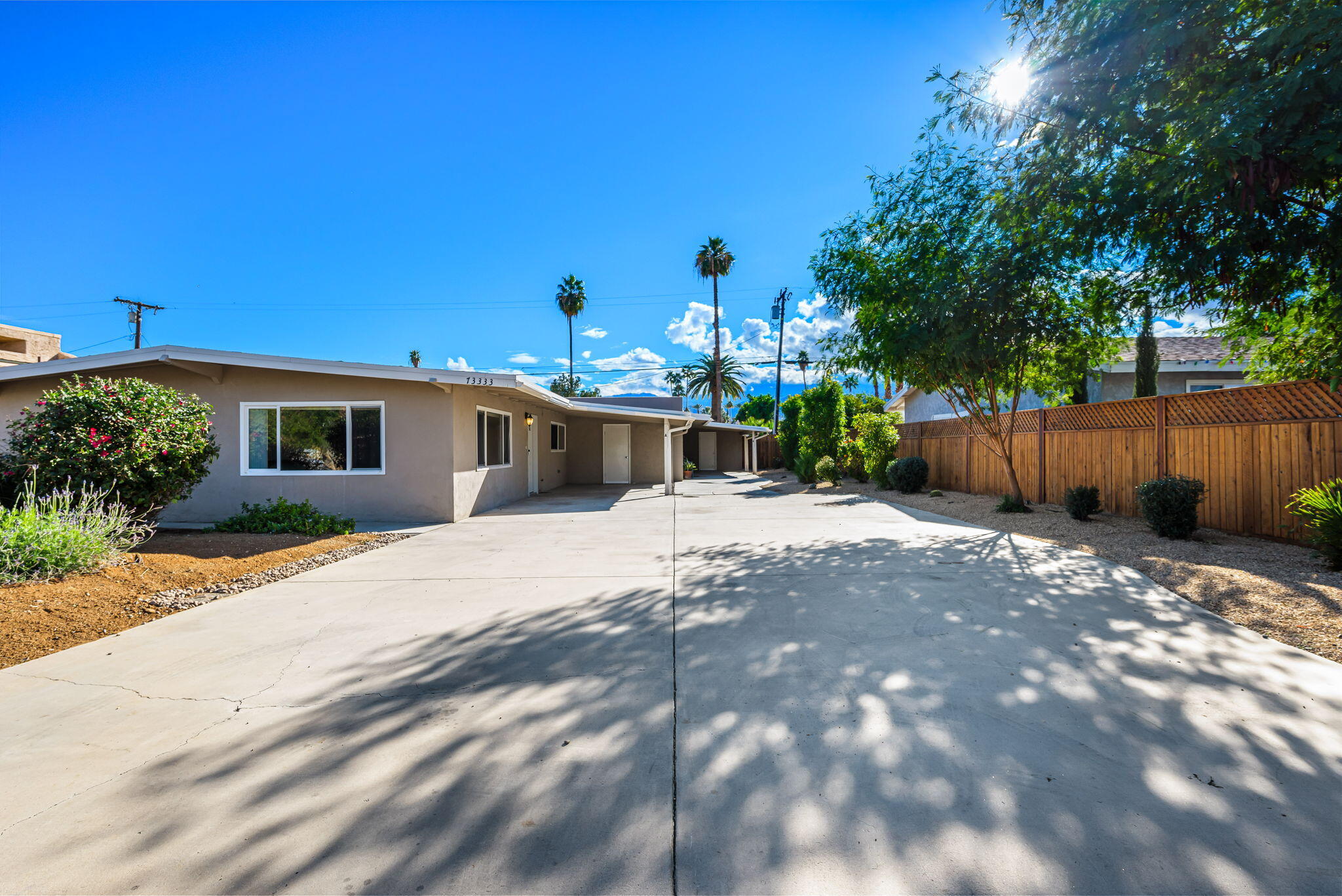 73333 Santa Rosa Way Palm Desert, CA 92260 - Photo 2 of 37 a front view of a house with a yard
