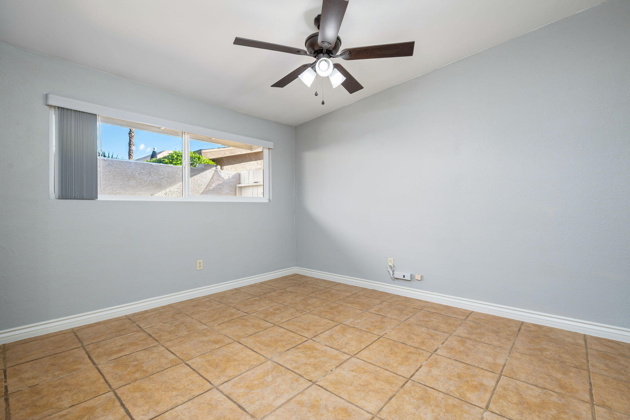 73333 Santa Rosa Way Palm Desert, CA 92260 - Photo 29 of 37 an empty room with windows and fan