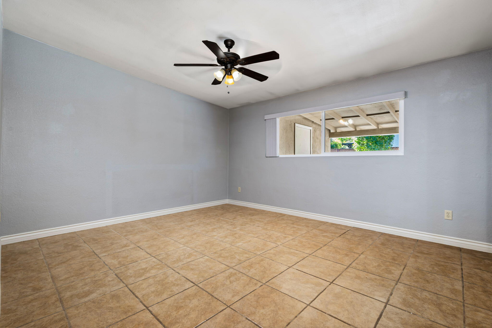 73333 Santa Rosa Way Palm Desert, CA 92260 - Photo 30 of 37 a view of room with window and ceiling fan