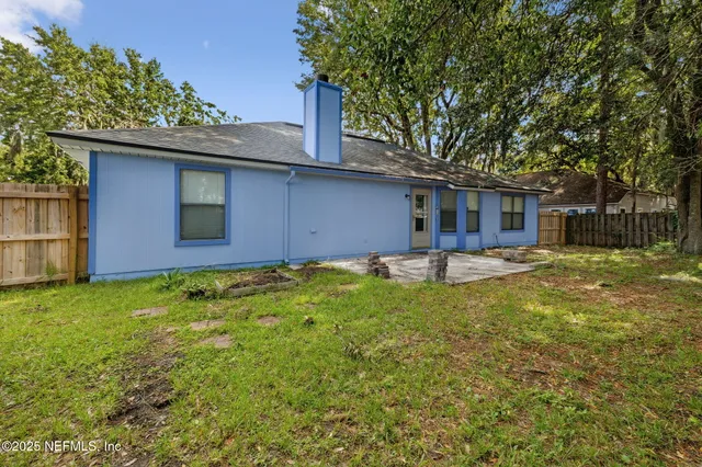 a backyard of a house with lots of green space