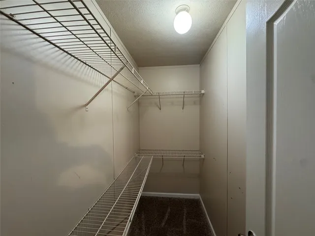 a kitchen with stainless steel appliances granite countertop a stove and a refrigerator