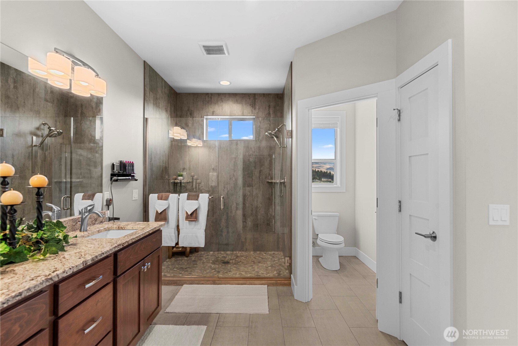 3525 Dianna Way Wenatchee, WA 98801 - Photo 11 of 28 a spacious bathroom with a granite countertop sink toilet and shower