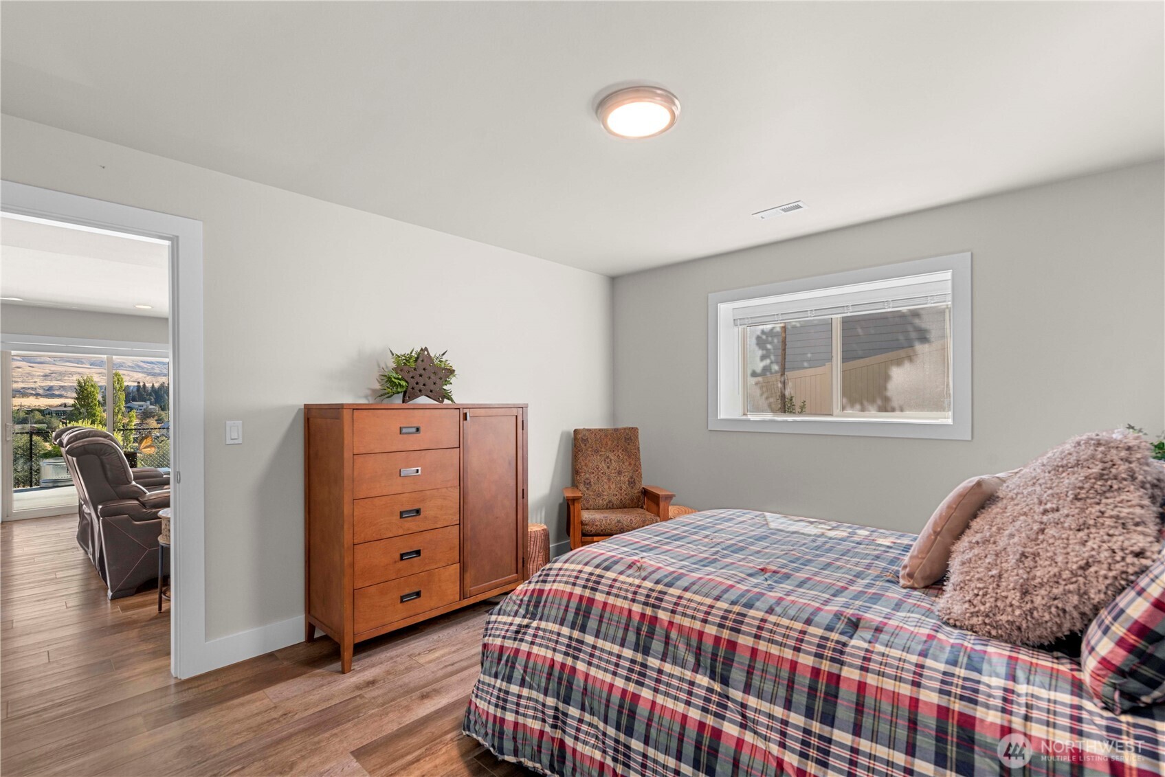 3525 Dianna Way Wenatchee, WA 98801 - Photo 14 of 28 a bedroom with a bed and wooden floor