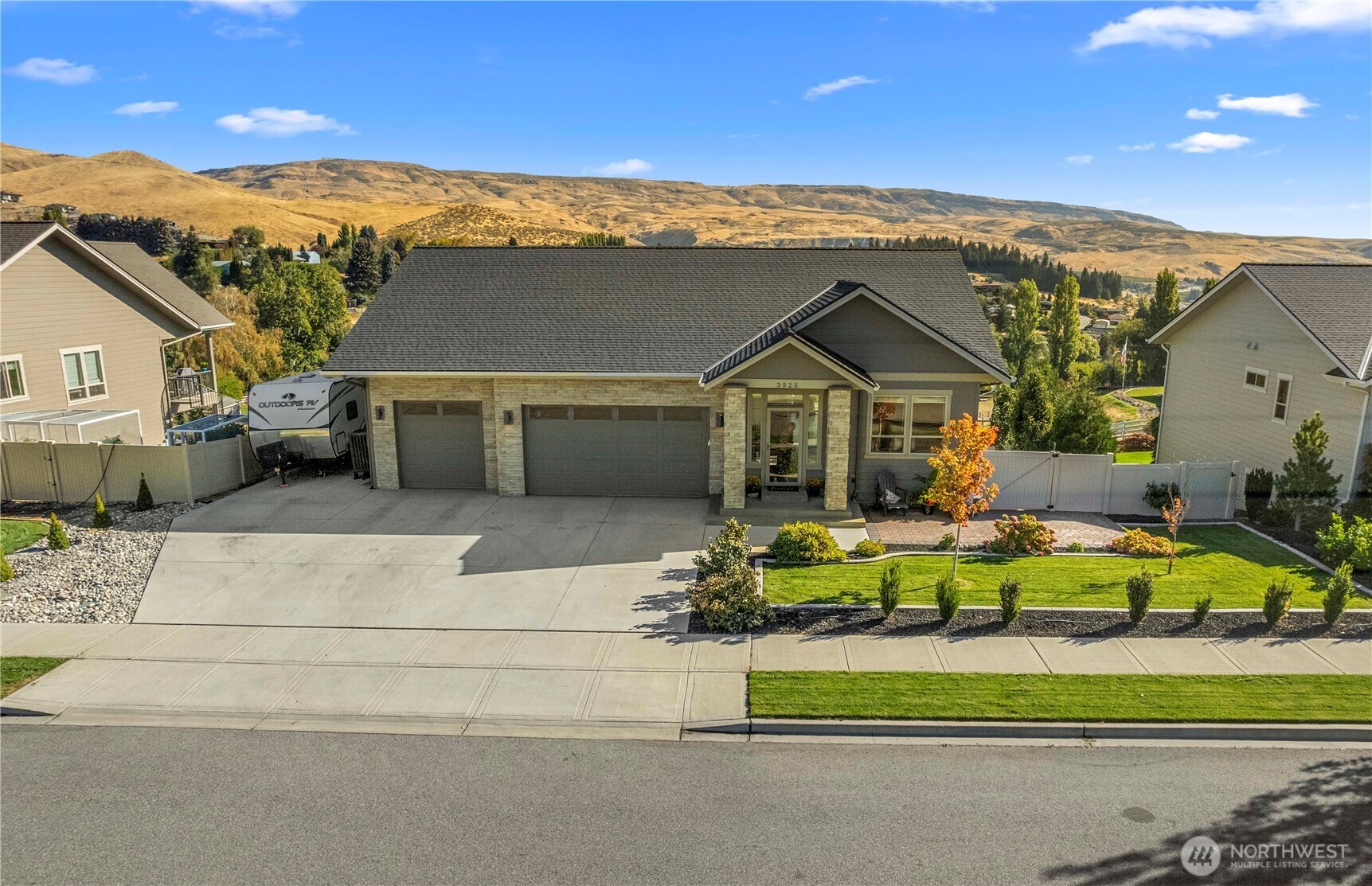 3525 Dianna Way Wenatchee, WA 98801 - Photo 27 of 28 a front view of a house with a garden and porch