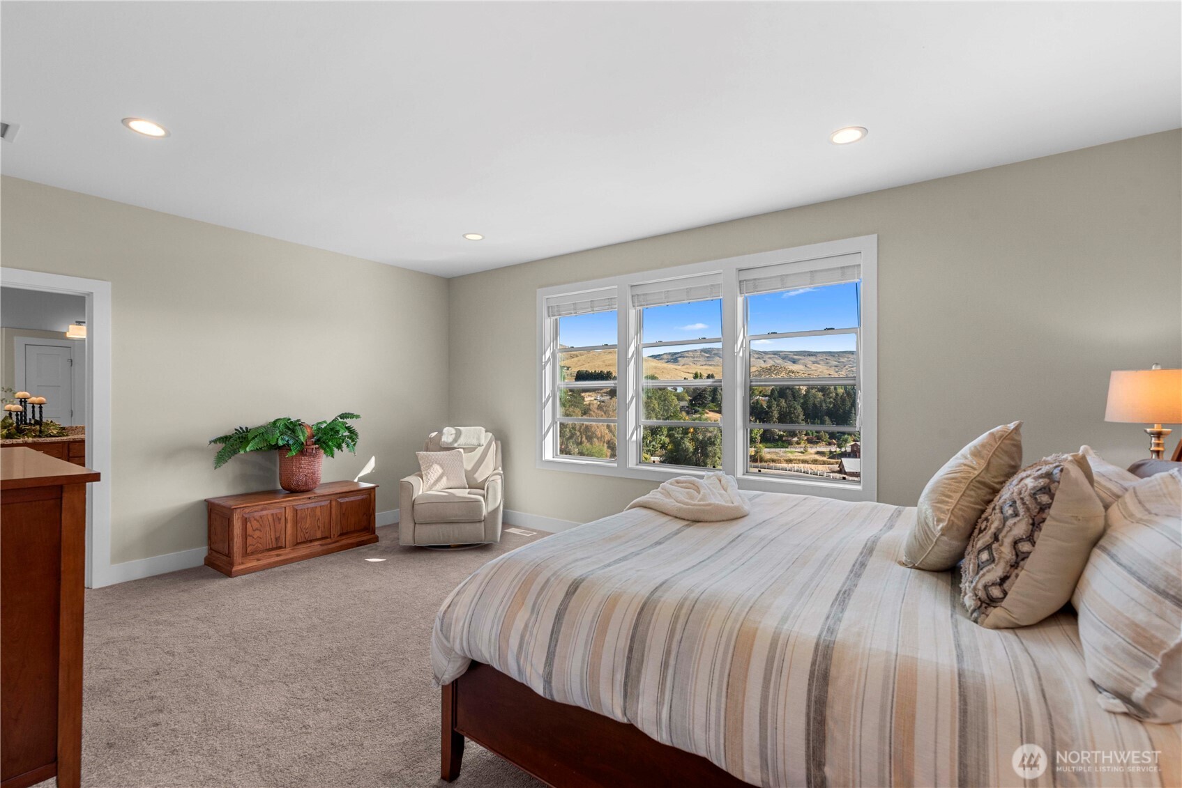 3525 Dianna Way Wenatchee, WA 98801 - Photo 10 of 28 a bedroom with a bed and large windows