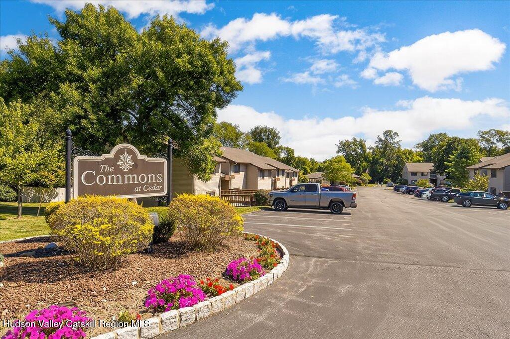 6 Knights Bridge, Unit B Poughkeepsie, NY 12603 - Photo 1 of 20 a front view of a house with a yard and garage