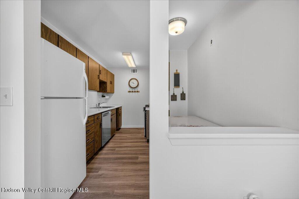 6 Knights Bridge, Unit B Poughkeepsie, NY 12603 - Photo 4 of 20 a kitchen with stainless steel appliances a refrigerator and a stove