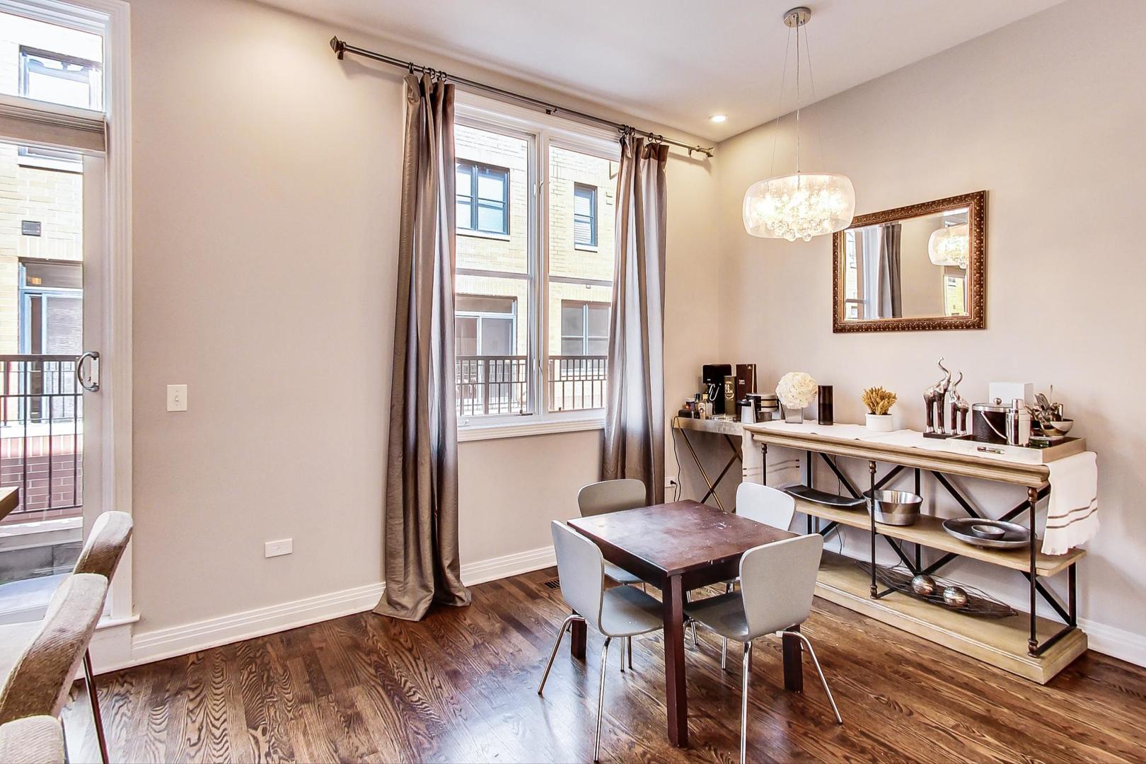1137 West Monroe Street Chicago, IL 60607 - Photo 11 of 33 a view of a dining room with furniture window and wooden floor