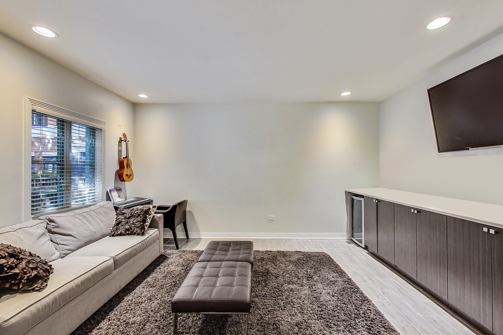 1137 West Monroe Street Chicago, IL 60607 - Photo 3 of 33 a living room with furniture and a flat screen tv