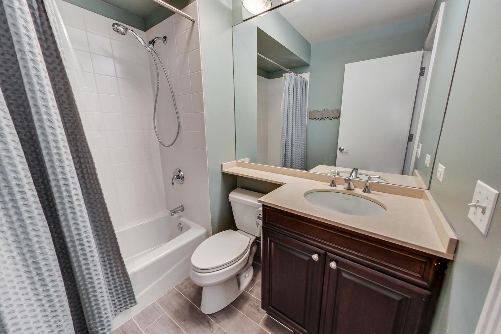 1137 West Monroe Street Chicago, IL 60607 - Photo 5 of 33 a bathroom with a sink toilet and shower