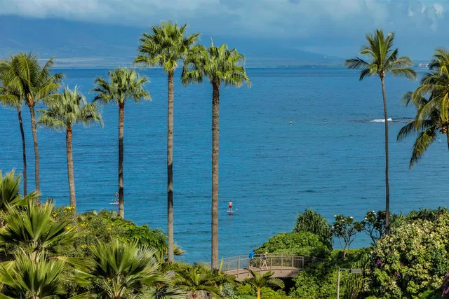 a view of a patio with a table and chairs