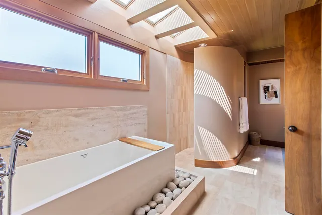 a bathroom with a bathtub and a sink