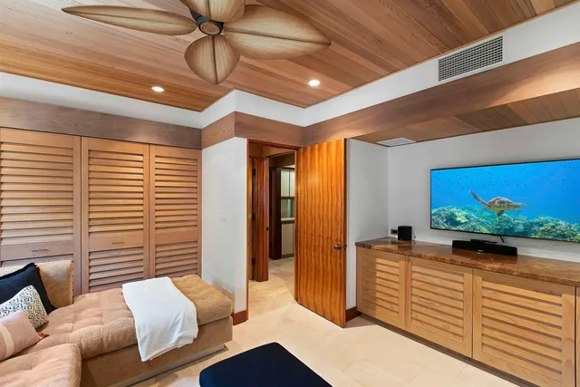a bathroom with a granite countertop sink toilet a mirror and shower