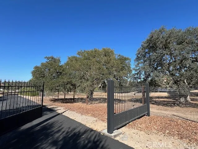 1810 Fire Rock Loop Templeton, CA 93465 - Photo 8 of 8 a view of a pathway with a wrought fence