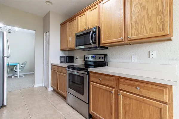 a kitchen with stainless steel appliances granite countertop a stove and a sink