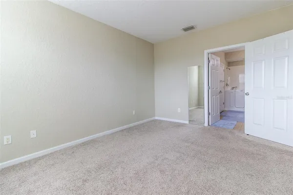 a bathroom with a double vanity sink mirror and shower