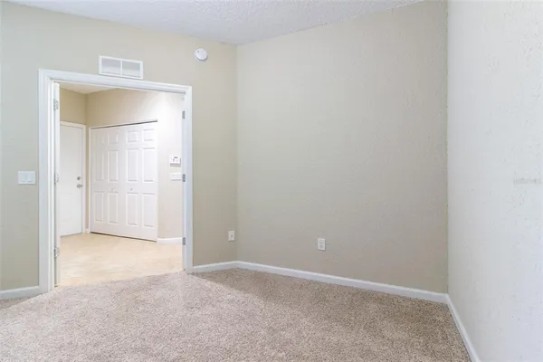 an empty room with a bathroom