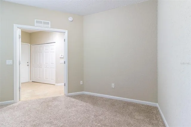 an empty room with a bathroom