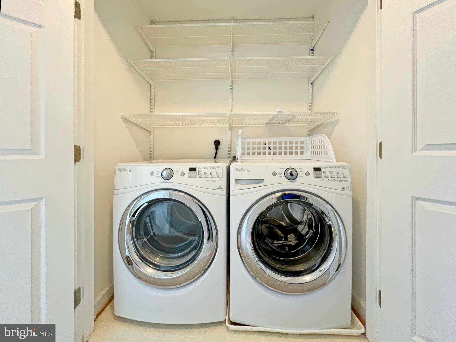 11117 Little Compton Drive Reston, VA 20191 - Photo 37 of 58 Modern laundry space with sleek appliances.