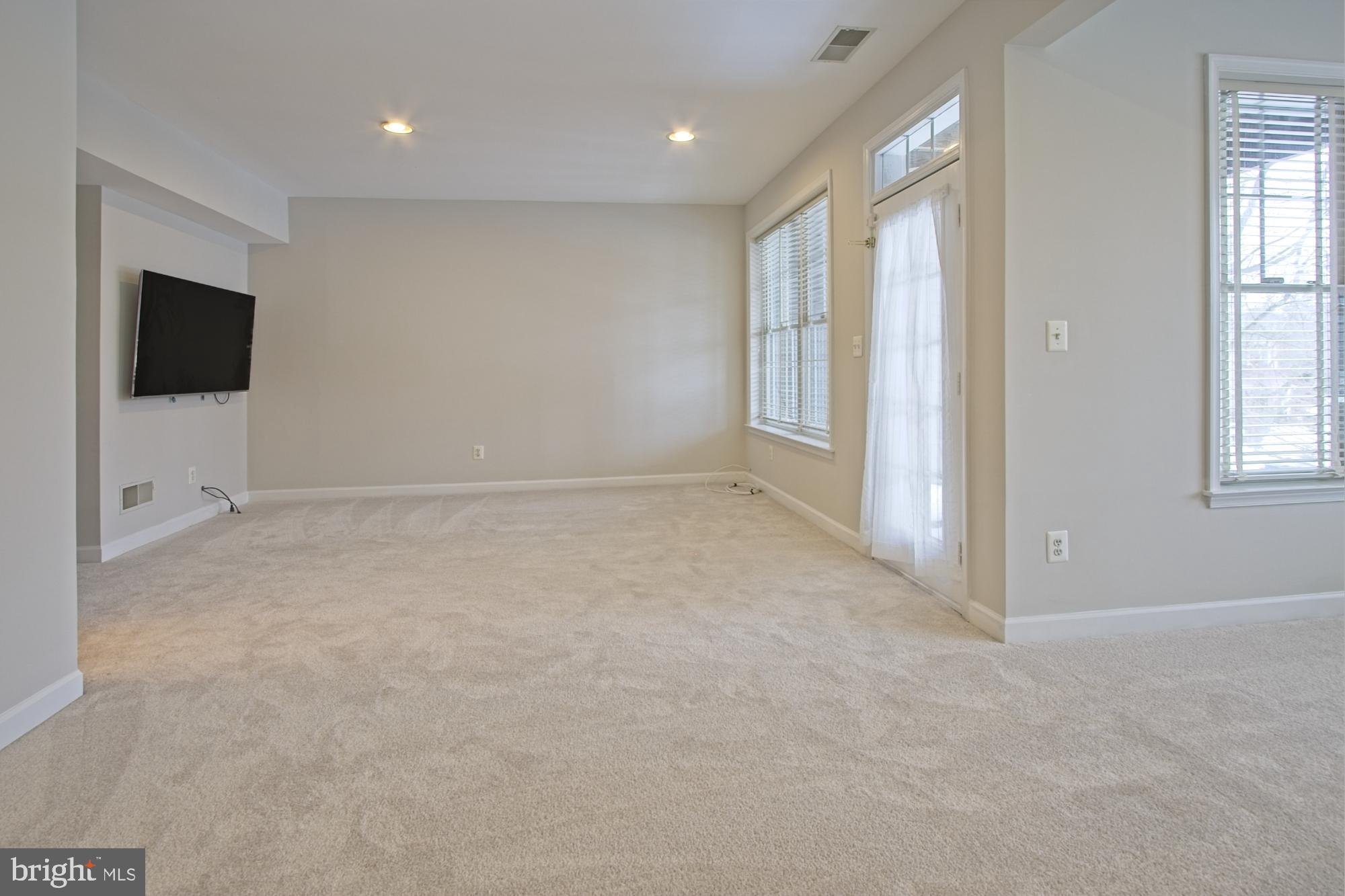 11117 Little Compton Drive Reston, VA 20191 - Photo 40 of 58 The wall mounted TV in this room conveys