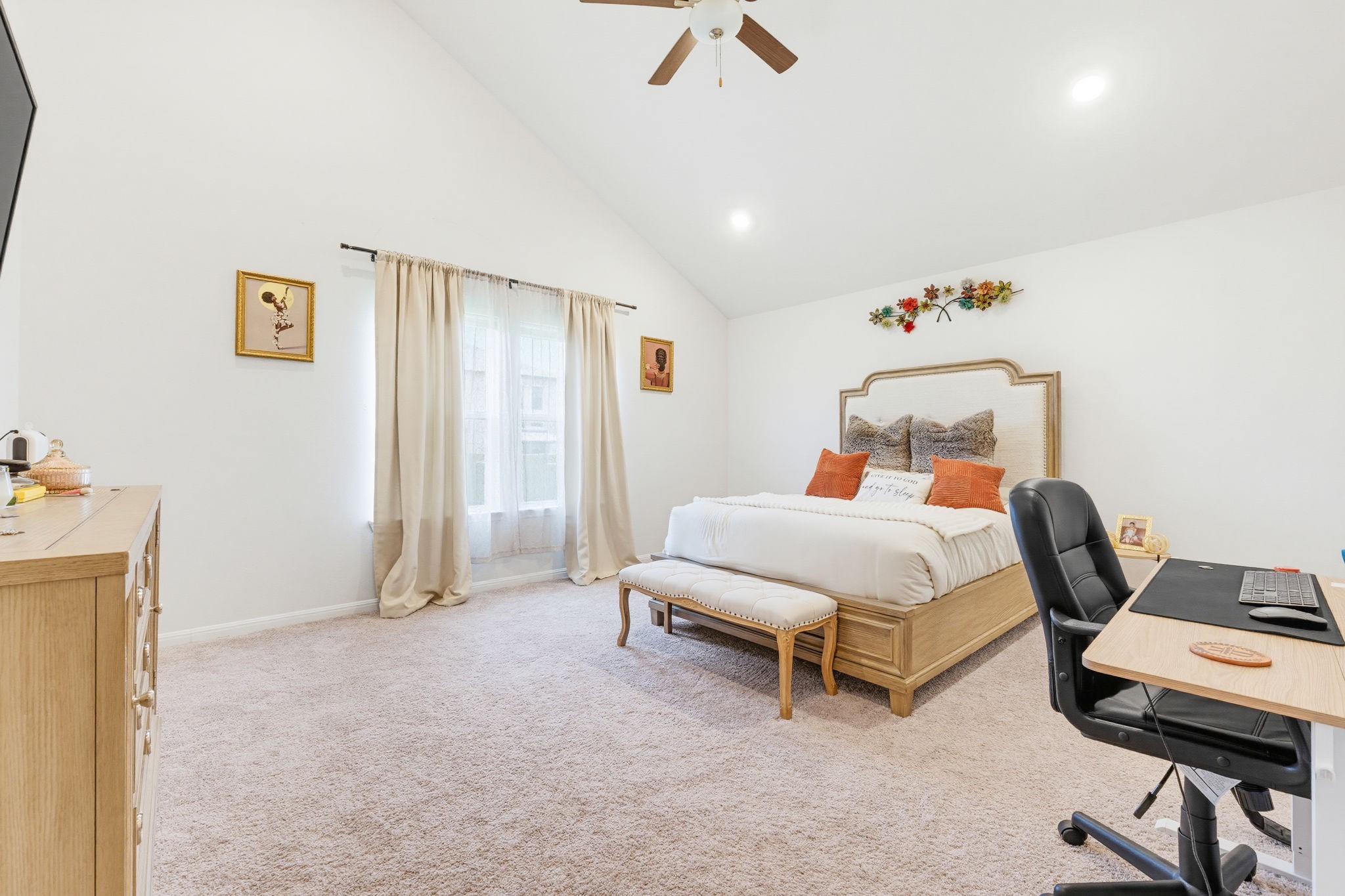 316 Windstar Road Liberty Hill, TX 78642 - Photo 14 of 27 a bedroom with a bed and a chandelier
