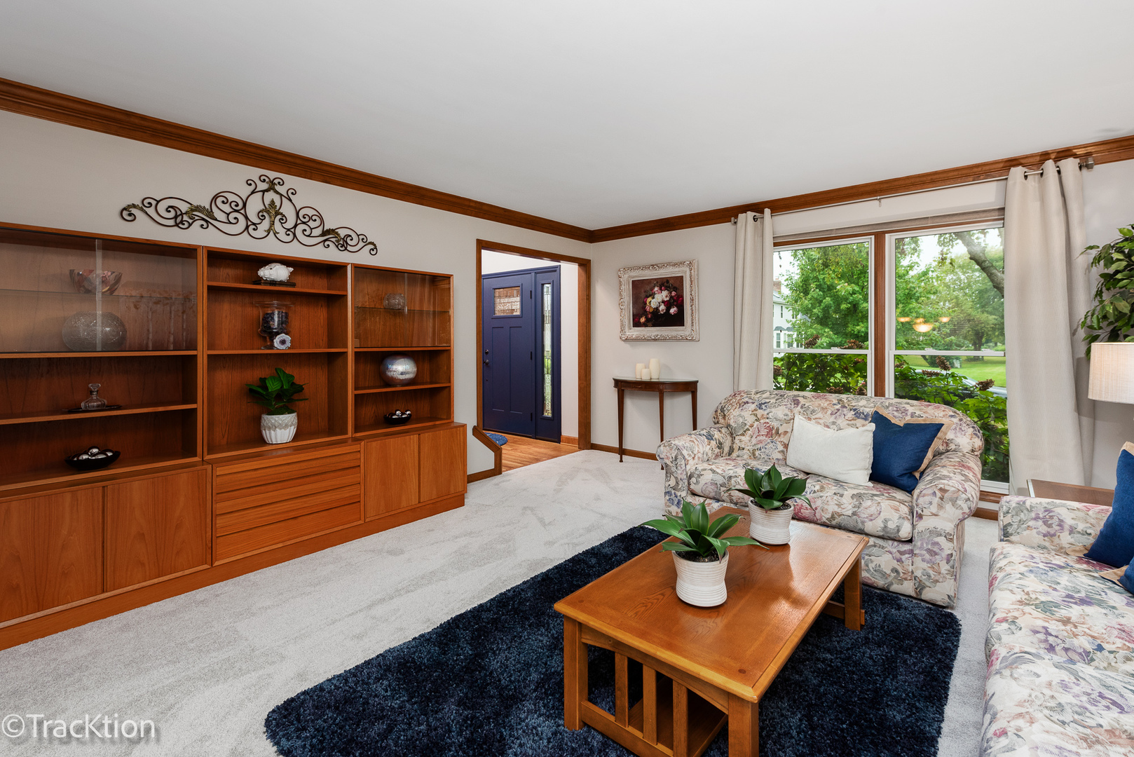 1740 Mundelein Road Naperville, IL 60565 - Photo 3 of 32 a living room with furniture a flat screen tv and a floor to ceiling window