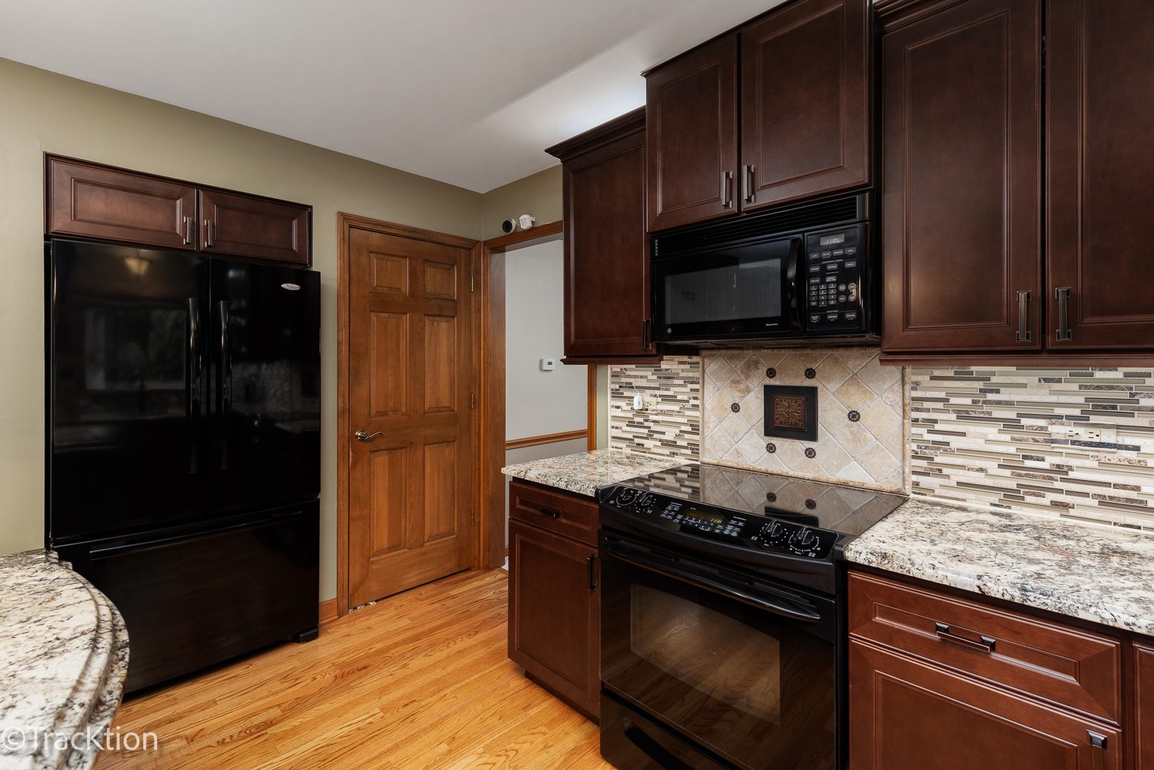 1740 Mundelein Road Naperville, IL 60565 - Photo 8 of 32 a kitchen with stainless steel appliances wooden cabinets and a stove top oven