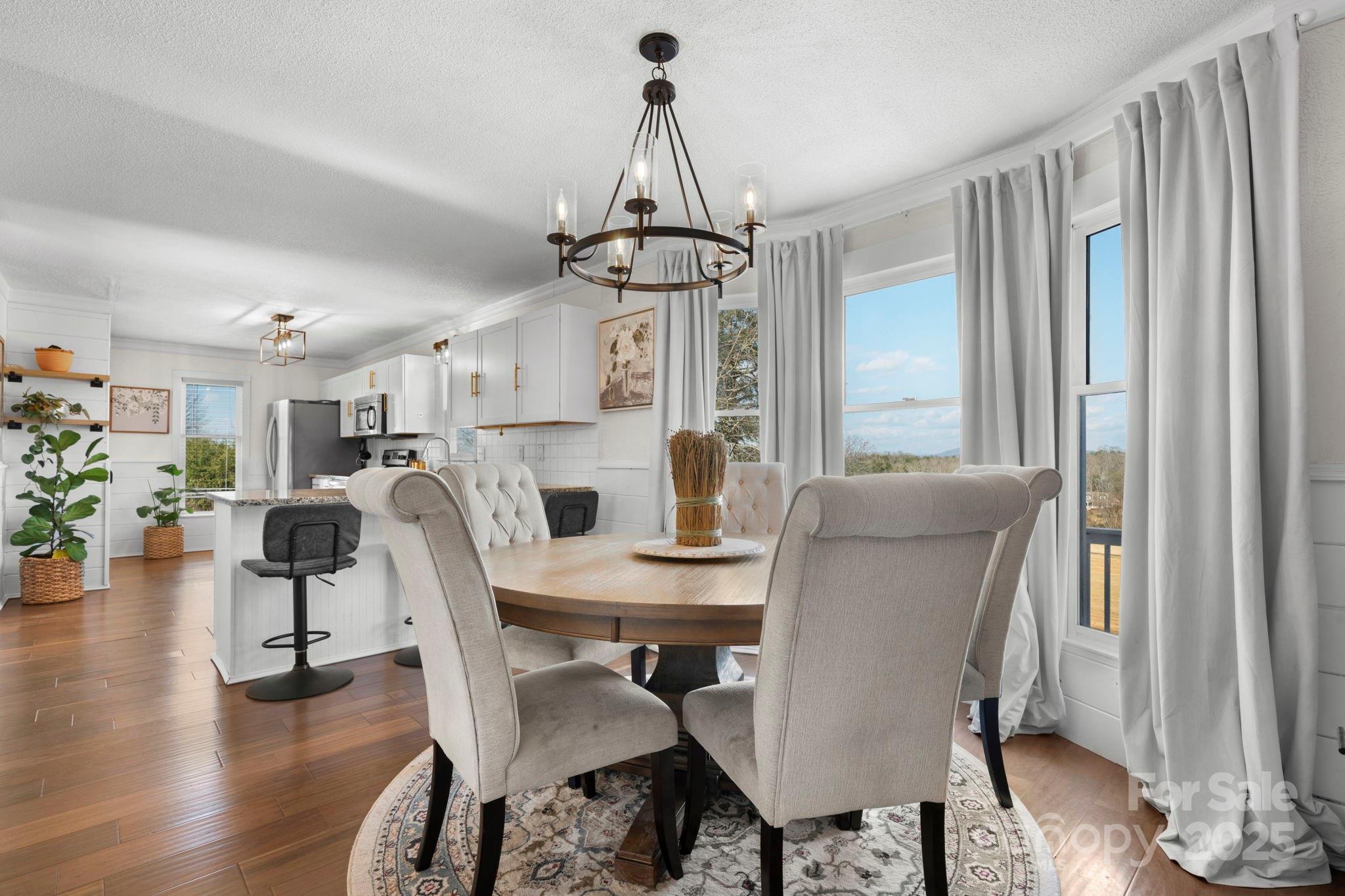 20 Meandering Way Granite Falls, NC 28630 - Photo 20 of 39 a view of a dining room with furniture window and wooden floor